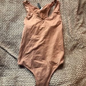blush pink body suit